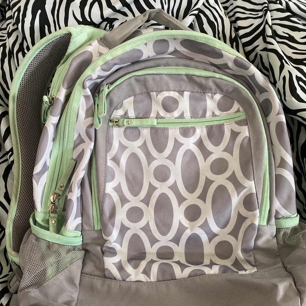 Grey white green backpack